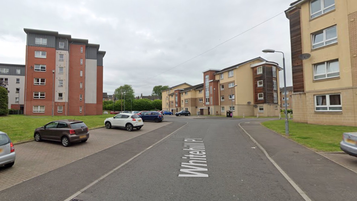 Woman in hospital after falling out of flat window