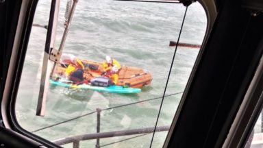 Lifeboats find man on charity paddle after distress call