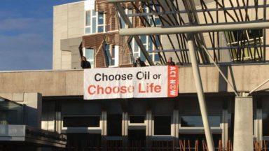 Climate change activists scale Scottish Parliament building