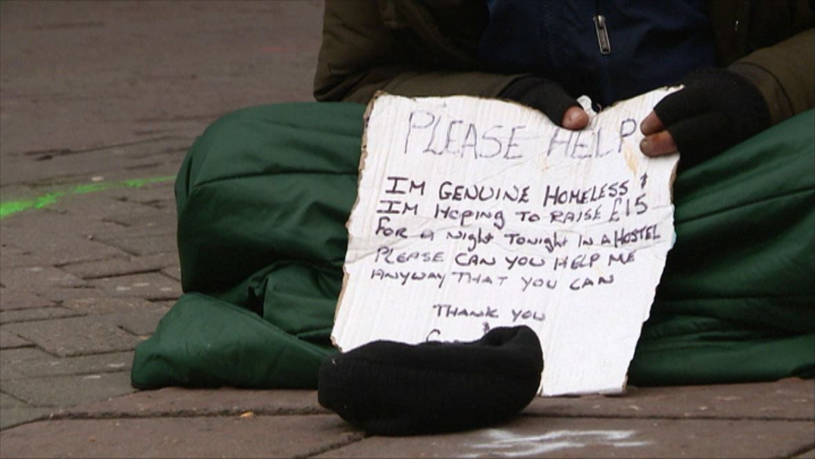 A homeless person tries to raise money to pay for a hostel.