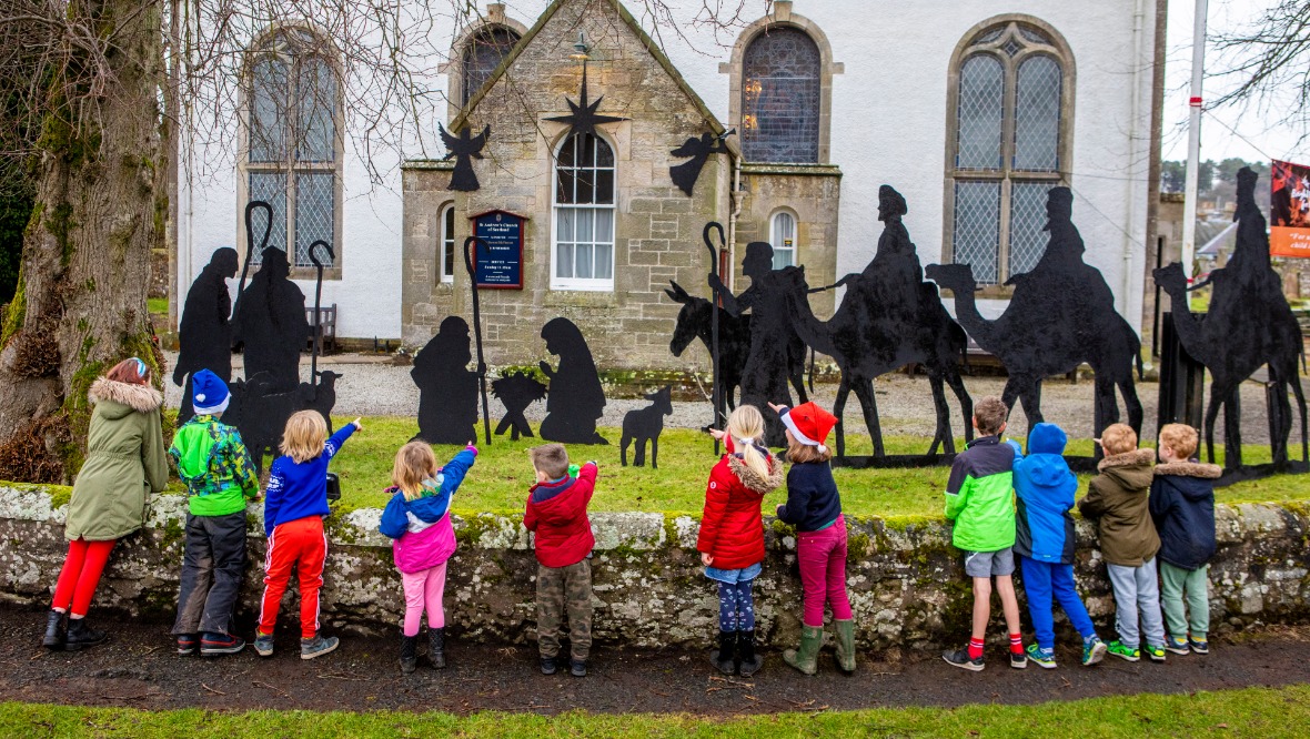 Shadowy figures bring Christmas cheer to village