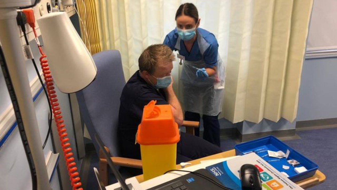 Mencnarowski receiving his Covid-19 vaccination. Credit: STV