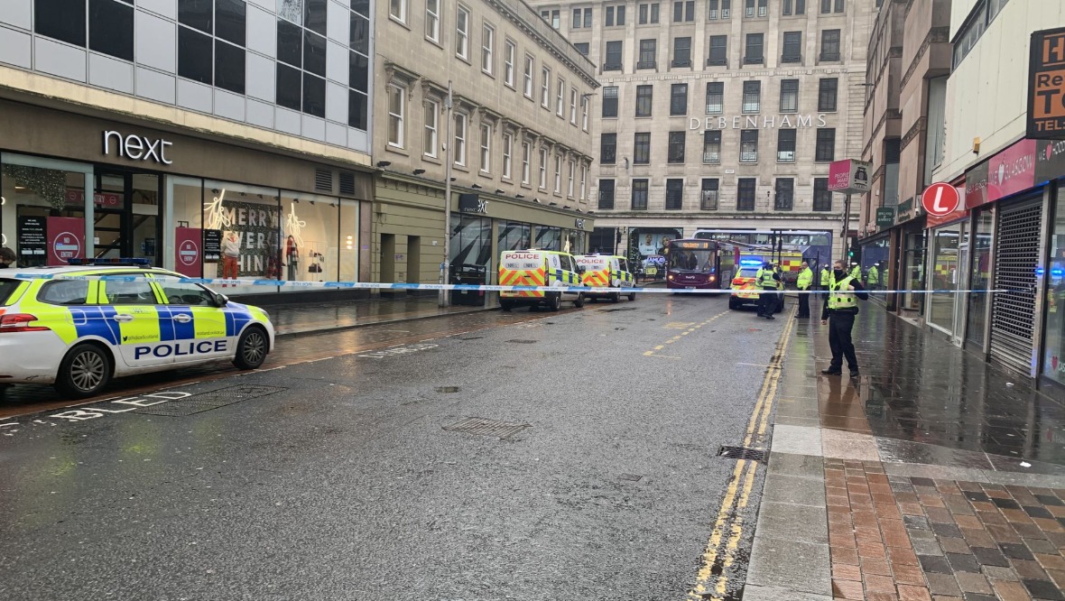 Pedestrian knocked down by bus on city centre street