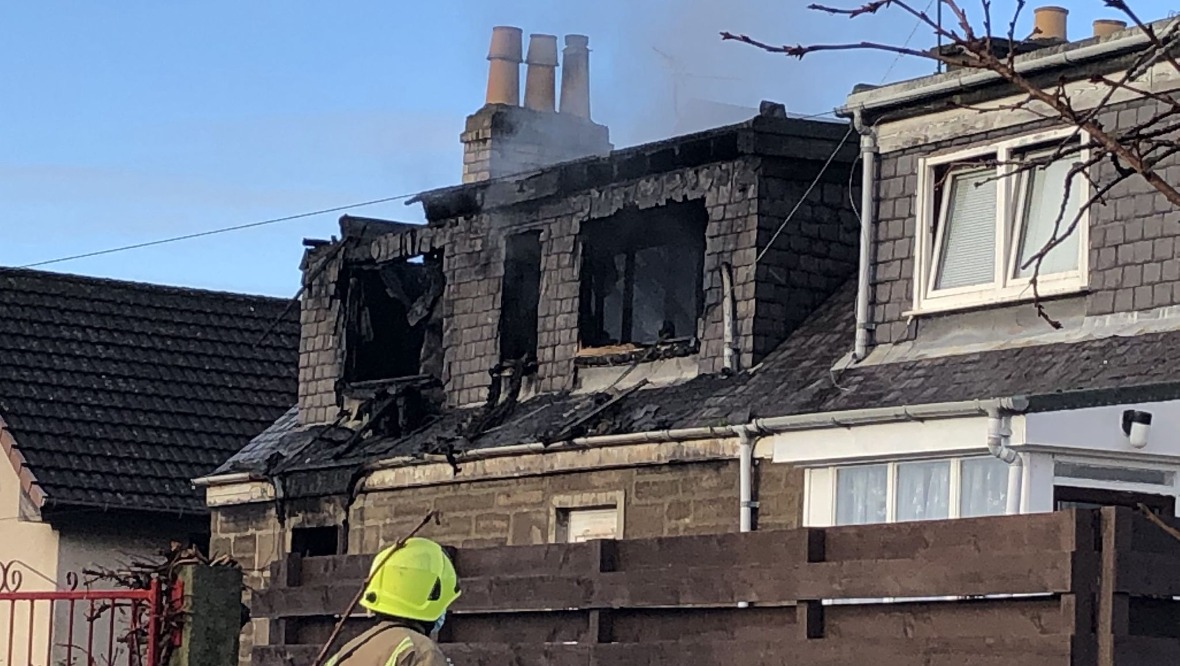 Woman, 82, dies in house fire as neighbours evacuated