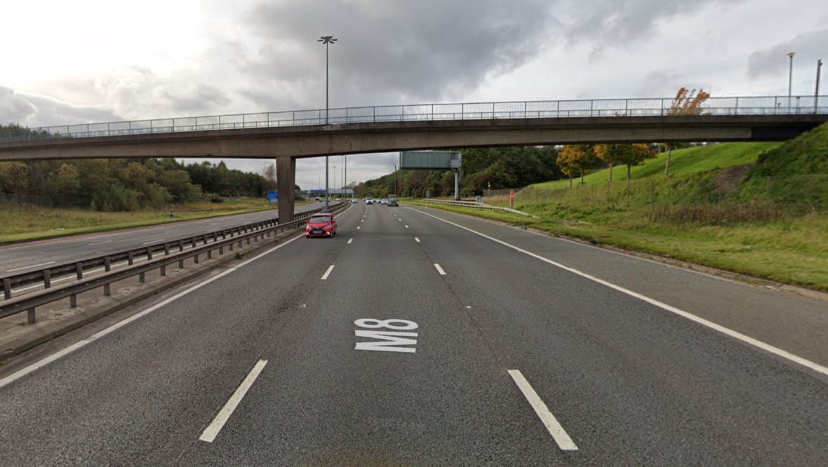 Driver ‘shaken’ after trolley thrown from bridge onto M8