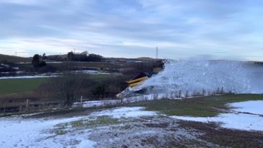 Rail plough smashes through snow to clear tracks