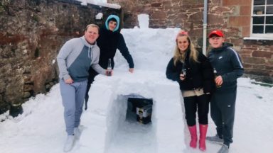 Housemates make the most of the snow to build ice cool igloo