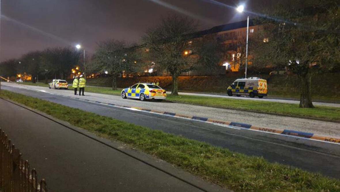 Police at scene of car crash on Edinburgh Road in Glasgow.