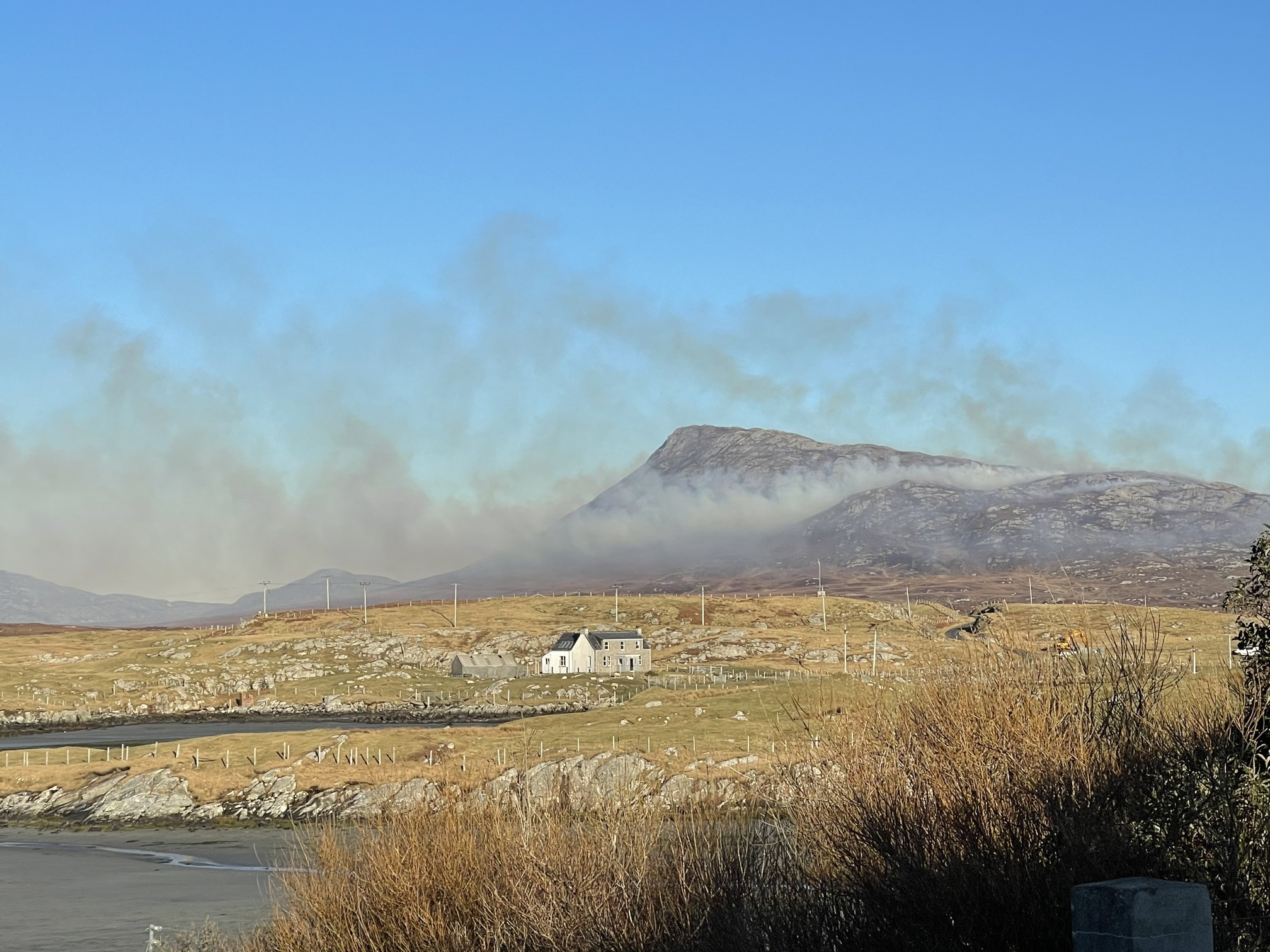 Smoke coming from behind Eabhal, North Uist (Michael Leather).