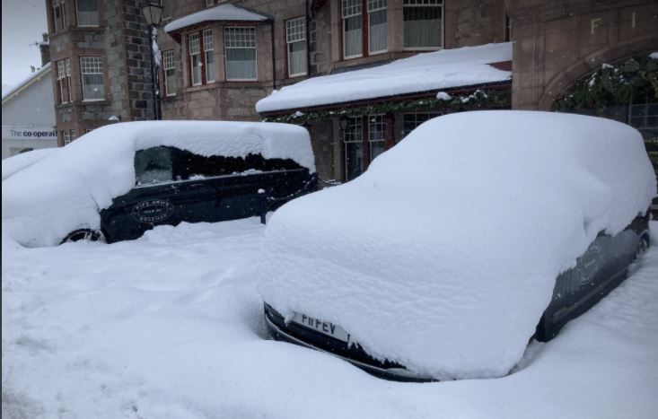 Snow covered cars in Braemar on Thursday.