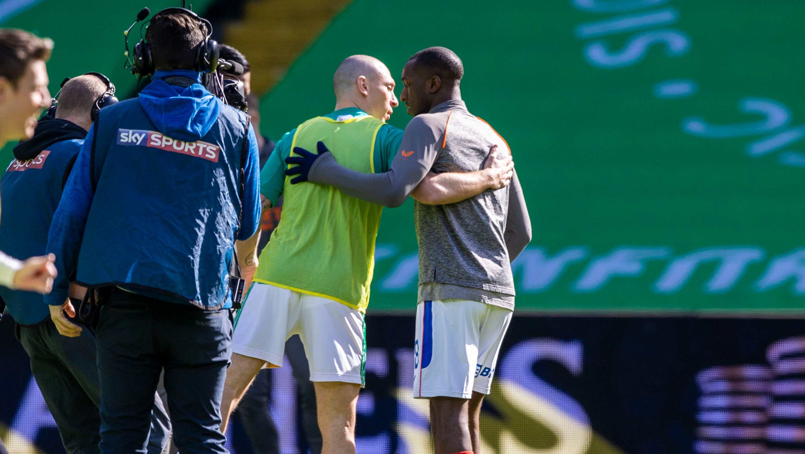 GLASGOW, SCOTLAND - MARCH 21: Celtic captain Scott Brown (left) embraces Rangers' Glen Kamara pre match during the Scottish Premiership match between Celtic and Rangers at Celtic Park, on March 21, 2021, in Glasgow, Scotland. (Photo by Craig Williamson / SNS Group)