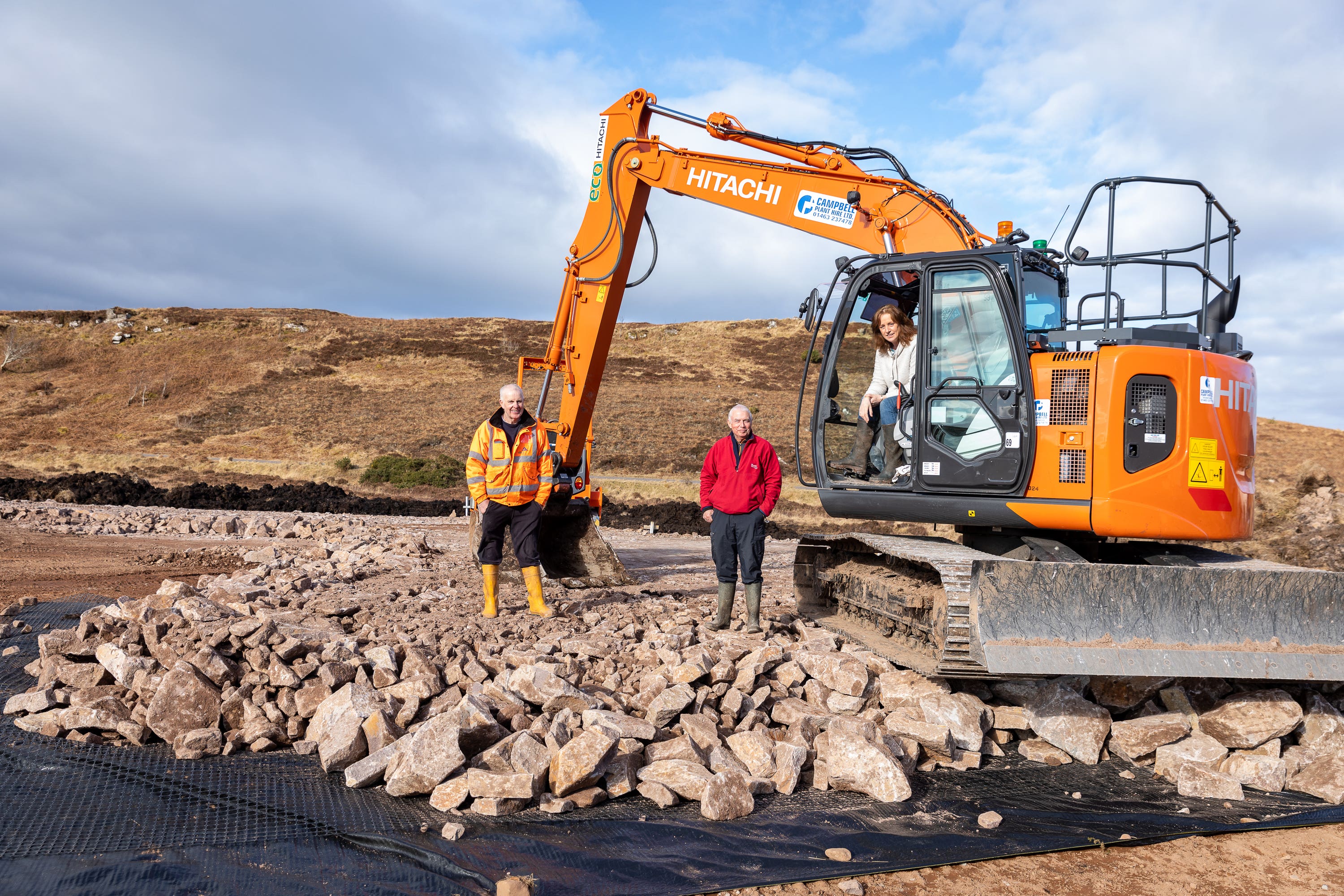 Kenny MacBeath, Dr Chris Ward and Heather Teale help out at the site of the helipad in Applecross.
