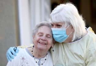 Daughter finally hugs mum, 90, after care home visits resume