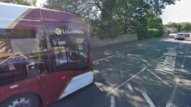 Bus window shattered and driver injured in missile attack