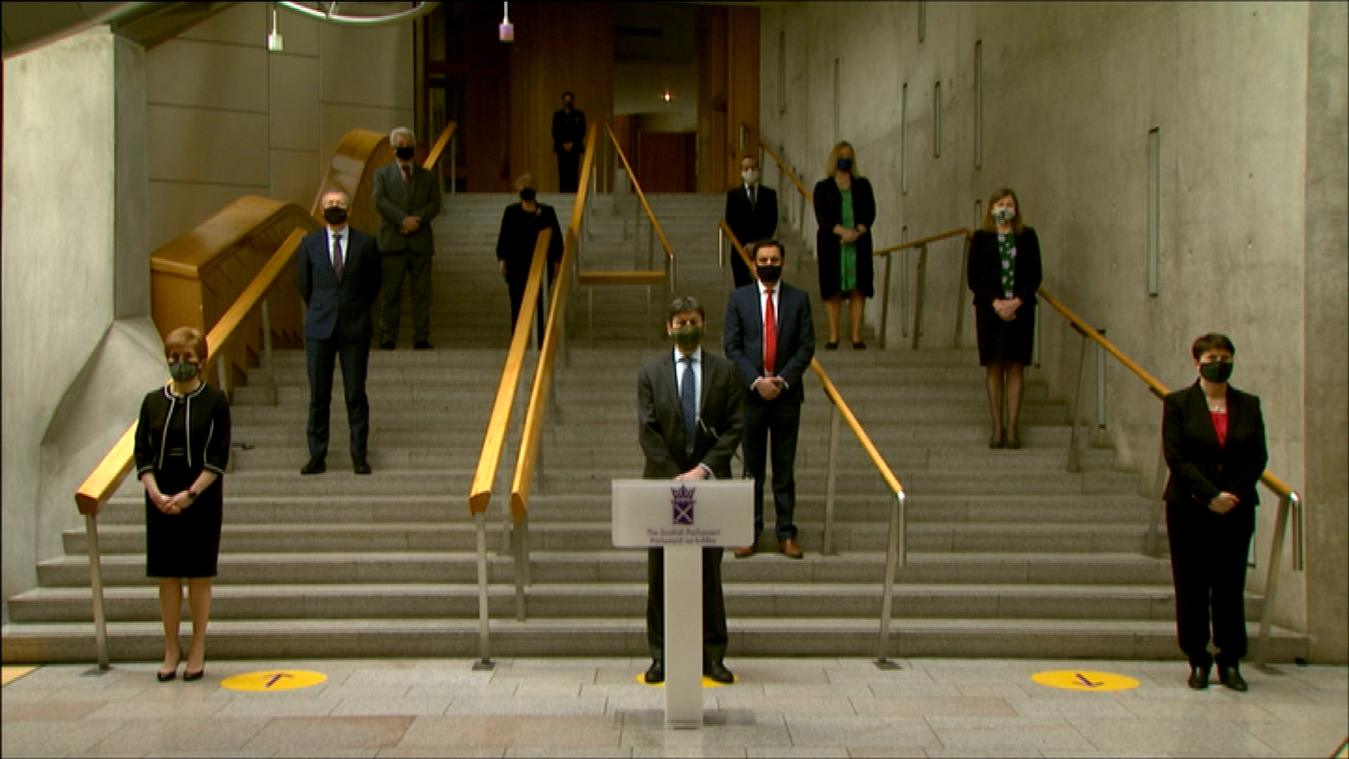 Party leaders gathered outside Holyrood to pay their respects.