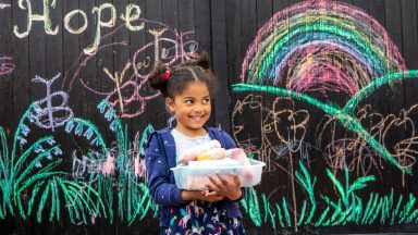 Five-year-old artist cheers up residents with chalk drawings