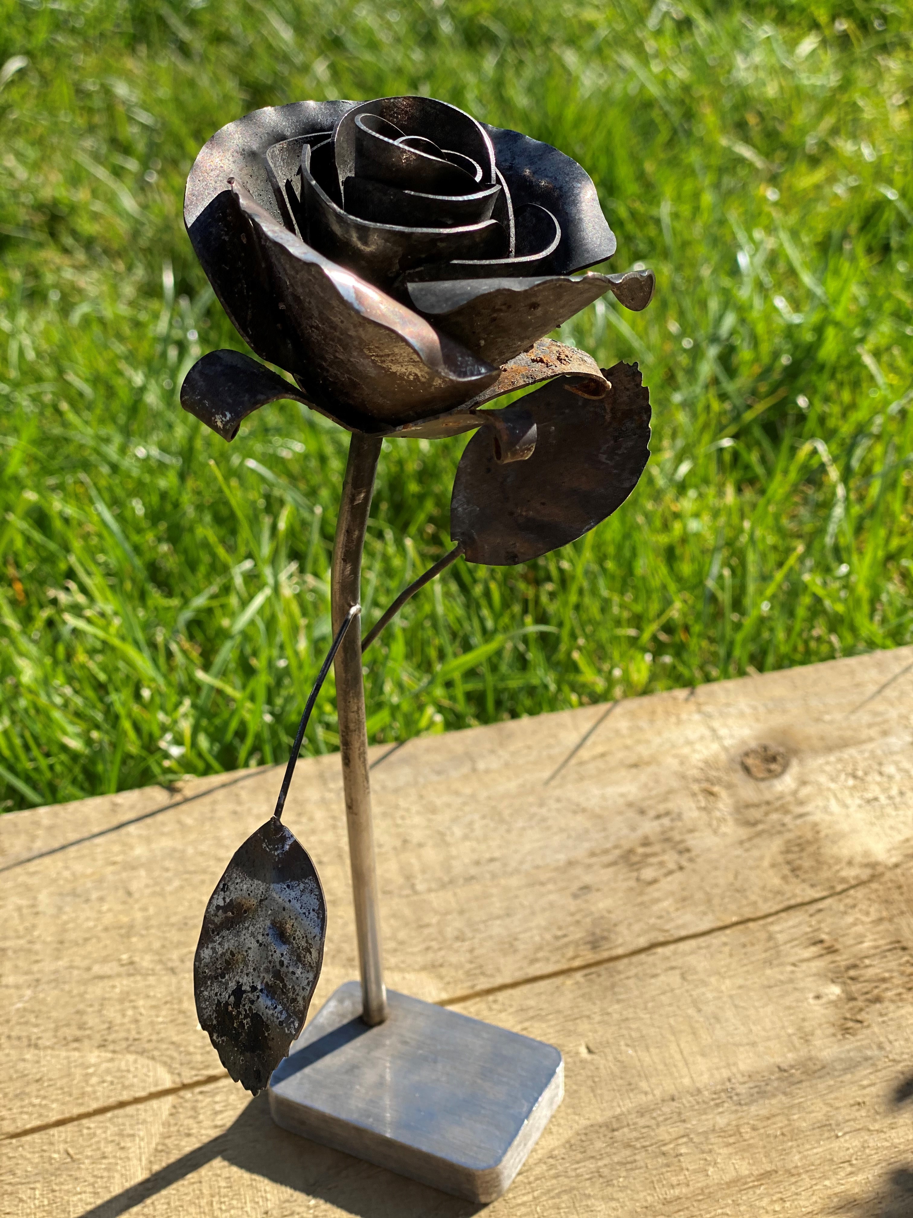 A rose ornament gifted to Jill Davies by her late husband Steve salvaged from the charred remains of their home (Submitted).