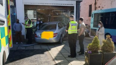 Car crashes through shopfront in town’s main street