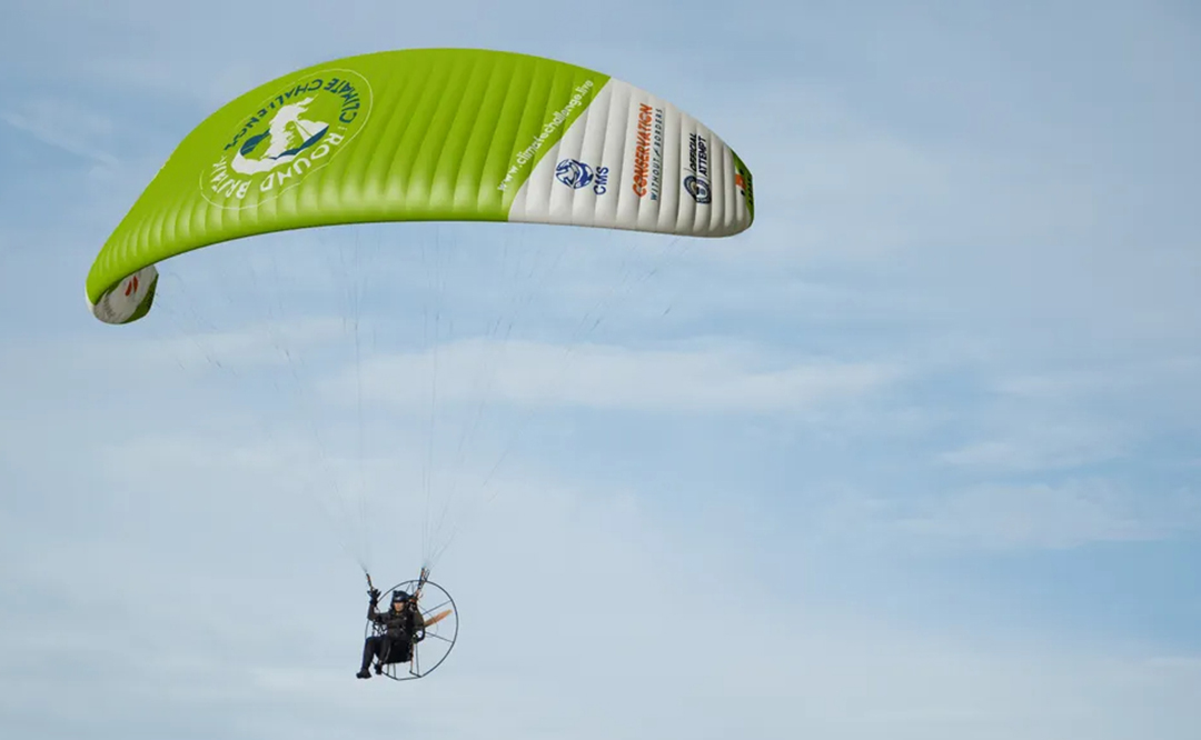 Mock-up of Sacha Dench flying with the Round Britain Climate Challenge wing.