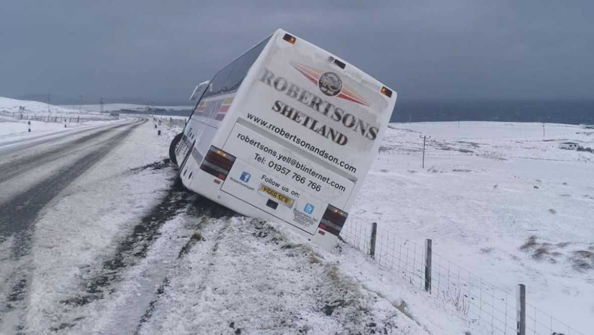 Two buses crash off road as snowy conditions grip north