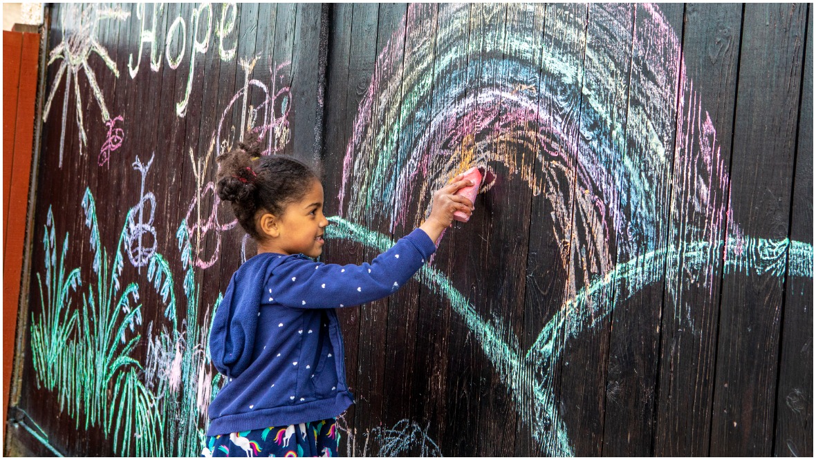 The five-year-old uses her imagination to create the colourful artworks. 