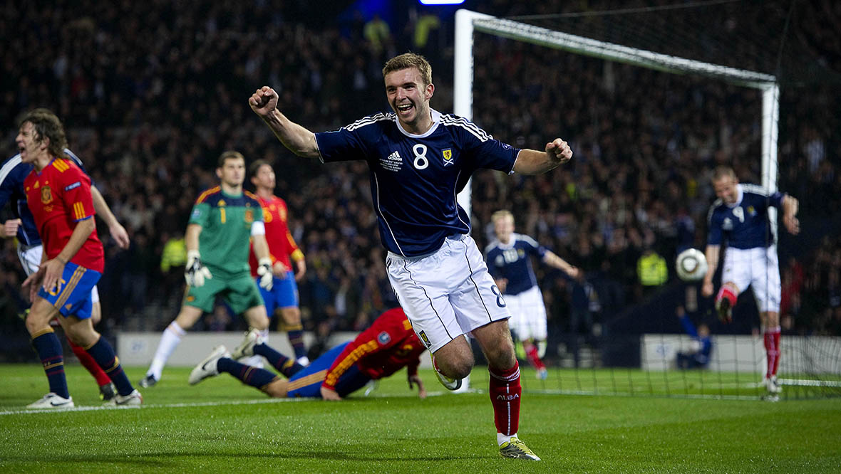 James Morrison celebrates after Pique's own goal.