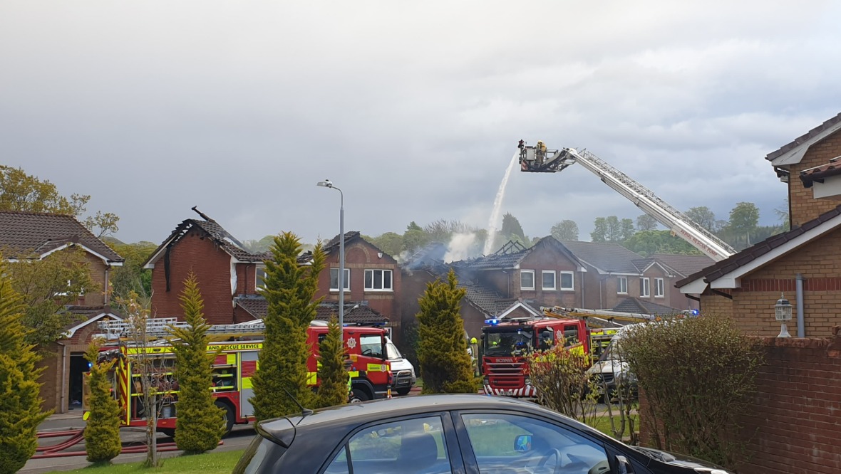 Crews tackle blaze as houses engulfed by well developed fire