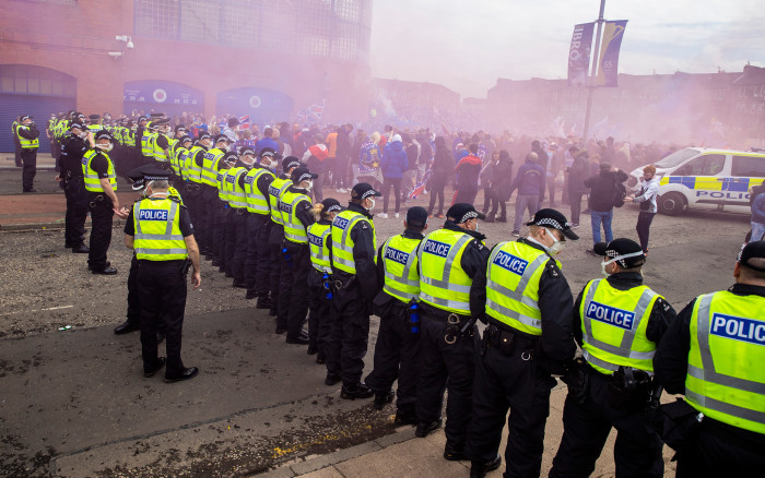 Police clear the area in front of the main entrance as Rangers fans celebrate lifting the Scottish Premiership title at Ibrox (Alan Harvey/SNS Group)