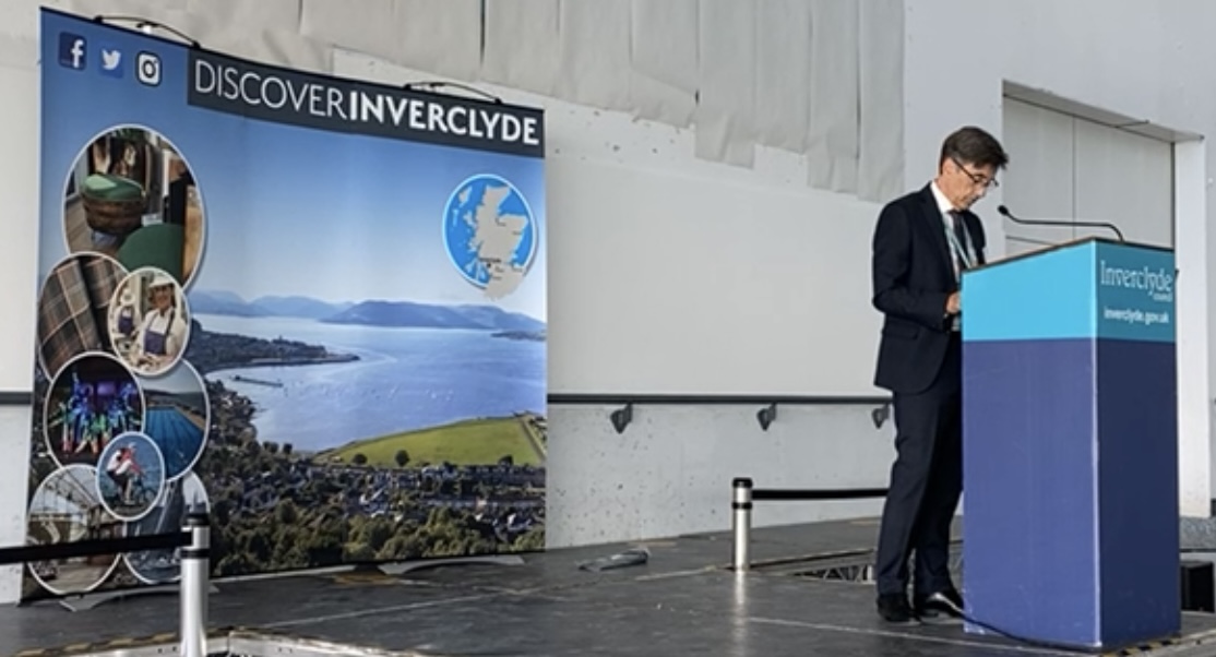 Inverclyde Council chief executive and returning officer Aubrey Fawcett speaks before the minute's silence in respect of all those affected by the  Greenock Blitz (Inverclyde Council)