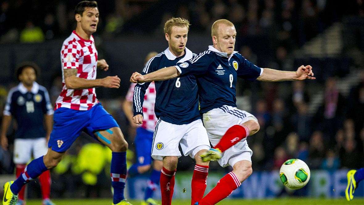 Steven Naismith scores his side's second of the game at Hampden as he follows up on team-mate Barry Bannan's penalty.