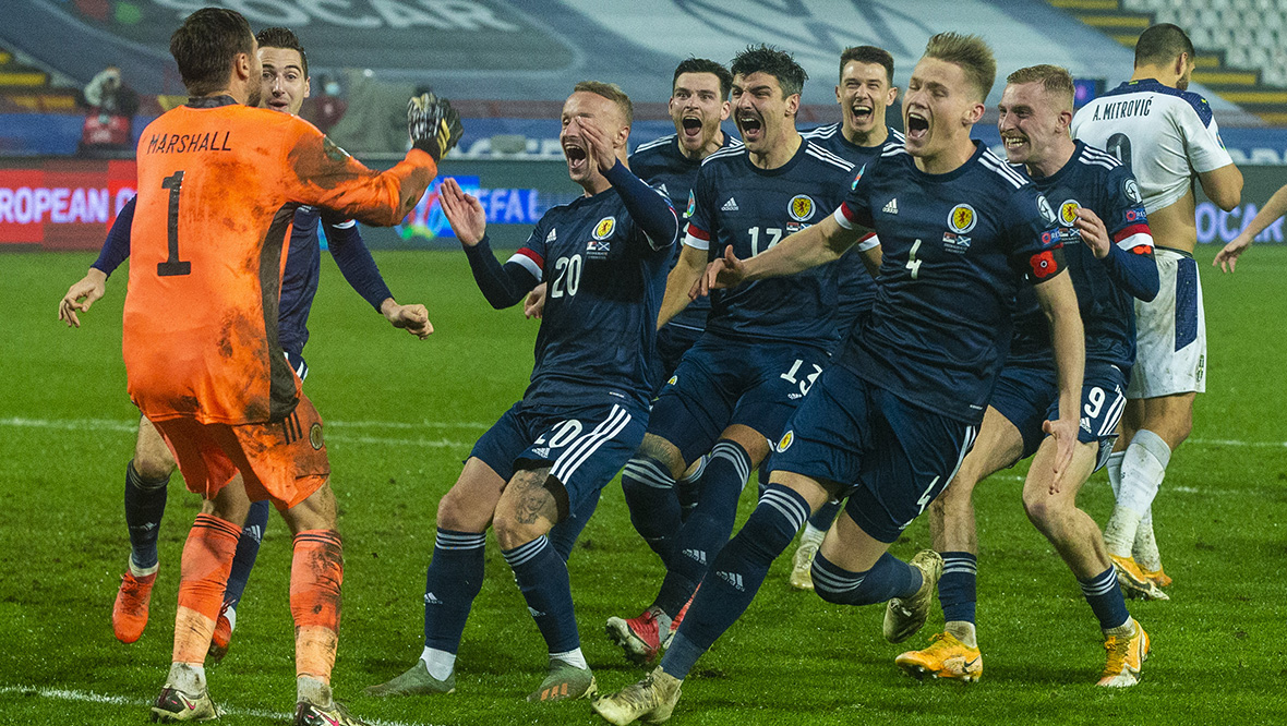 Scotland players celebrate after ending a 23-year qualifying hoodoo.