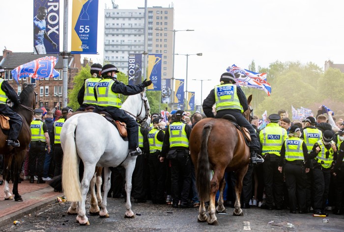 Police clear the area in front of the main entrance as Rangers fans celebrate lifting the Scottish Premiership title at Ibrox (Alan Harvey/SNS Group)