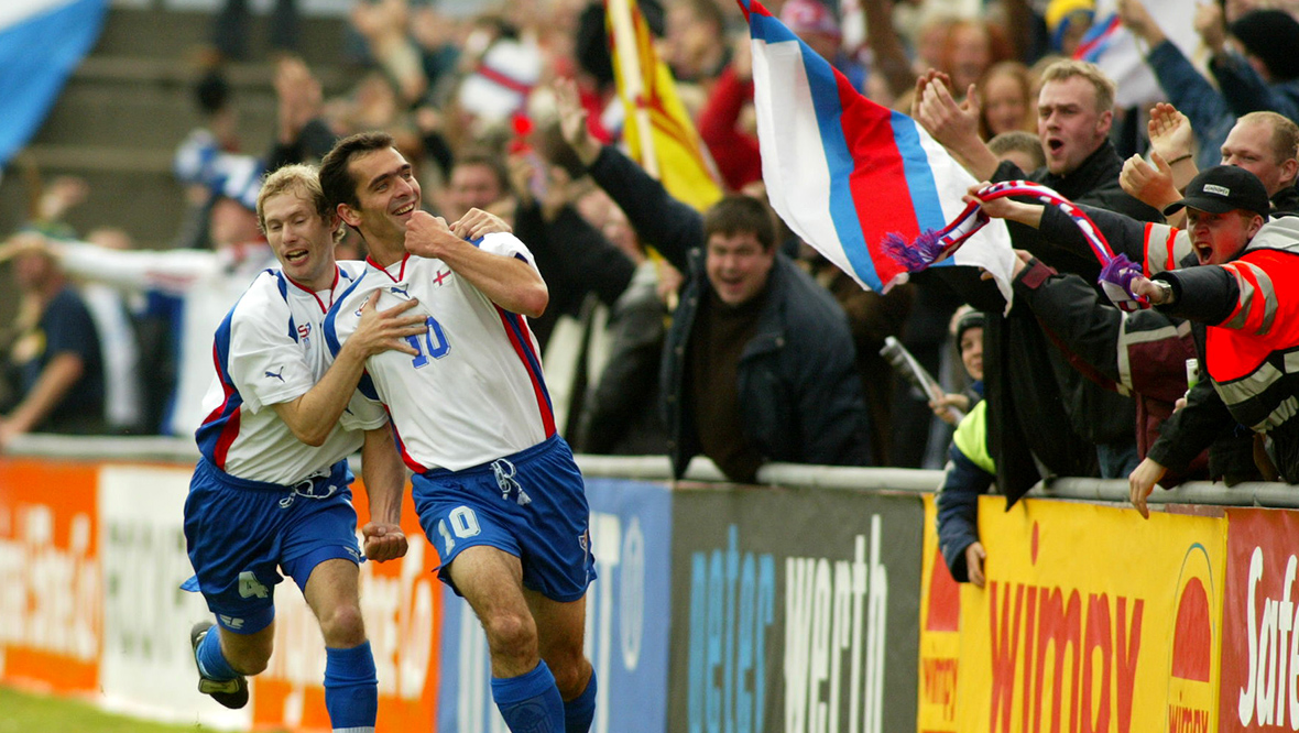 John Peterson celebrates his second goal against Scotland with Pol Thorsteinsson. 