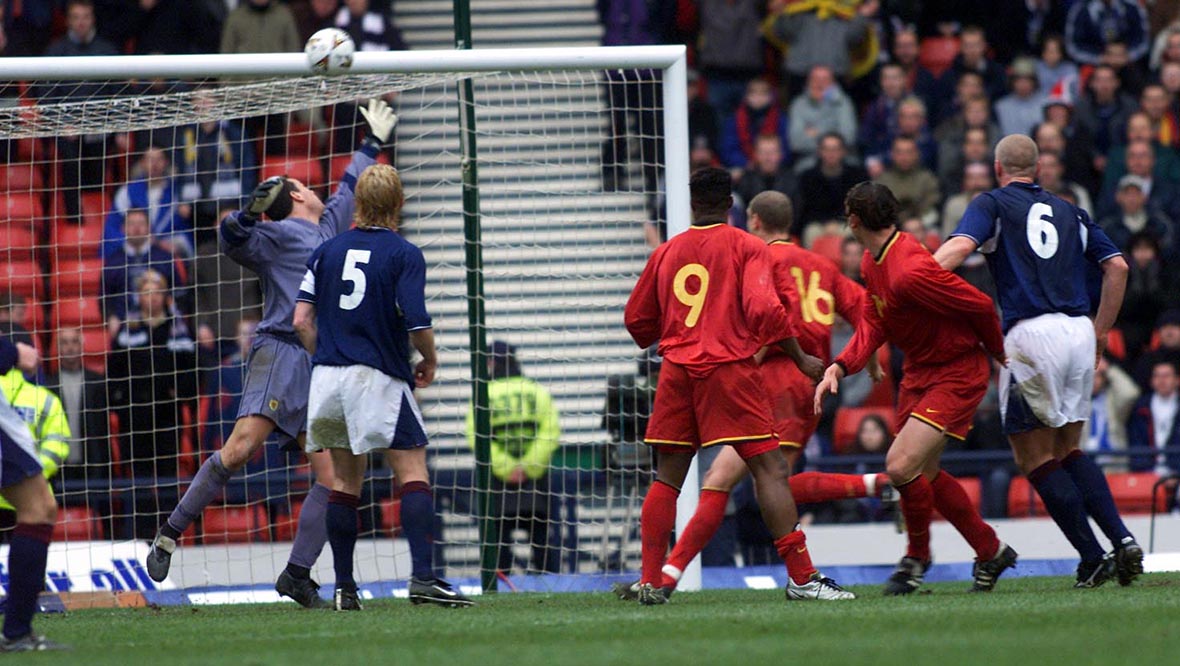 Daniel van Buyten (second from right) watches his injury-time header loop over the despairing lunge of Scotland goalkeeper Neil Sullivan.