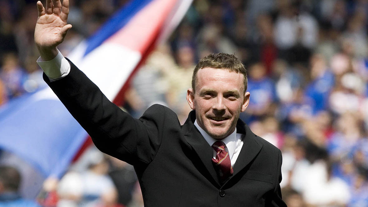 John Smeaton takes the acclaim of the crowd at Ibrox after his heroics during the Glasgow Airport terror attack in 2007.