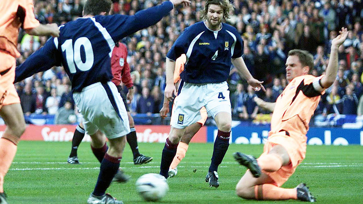 Steven Pressley looks on as James McFadden scores for Scotland against Netherlands.