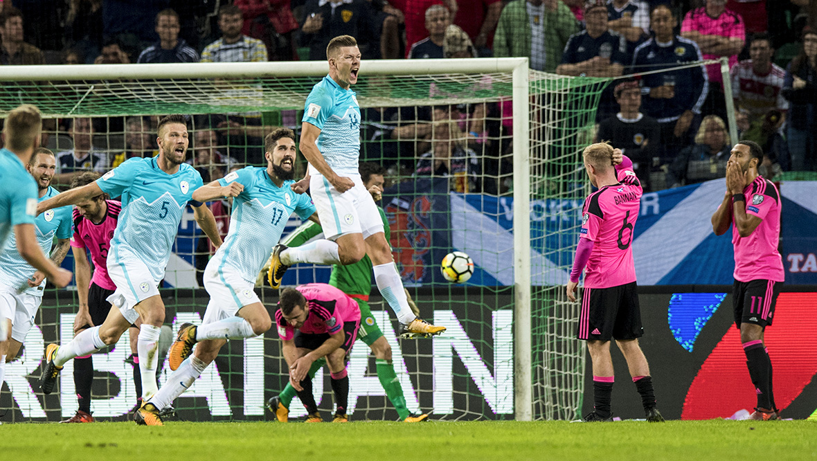 Roman Bekjak celebrates after scoring Slovenia's second goal.