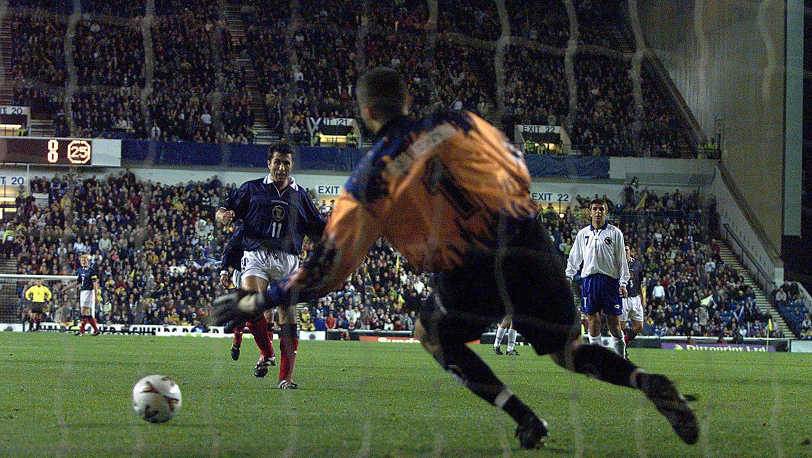 John Collins scores the winner against Bosnia from the penalty spot at Ibrox.