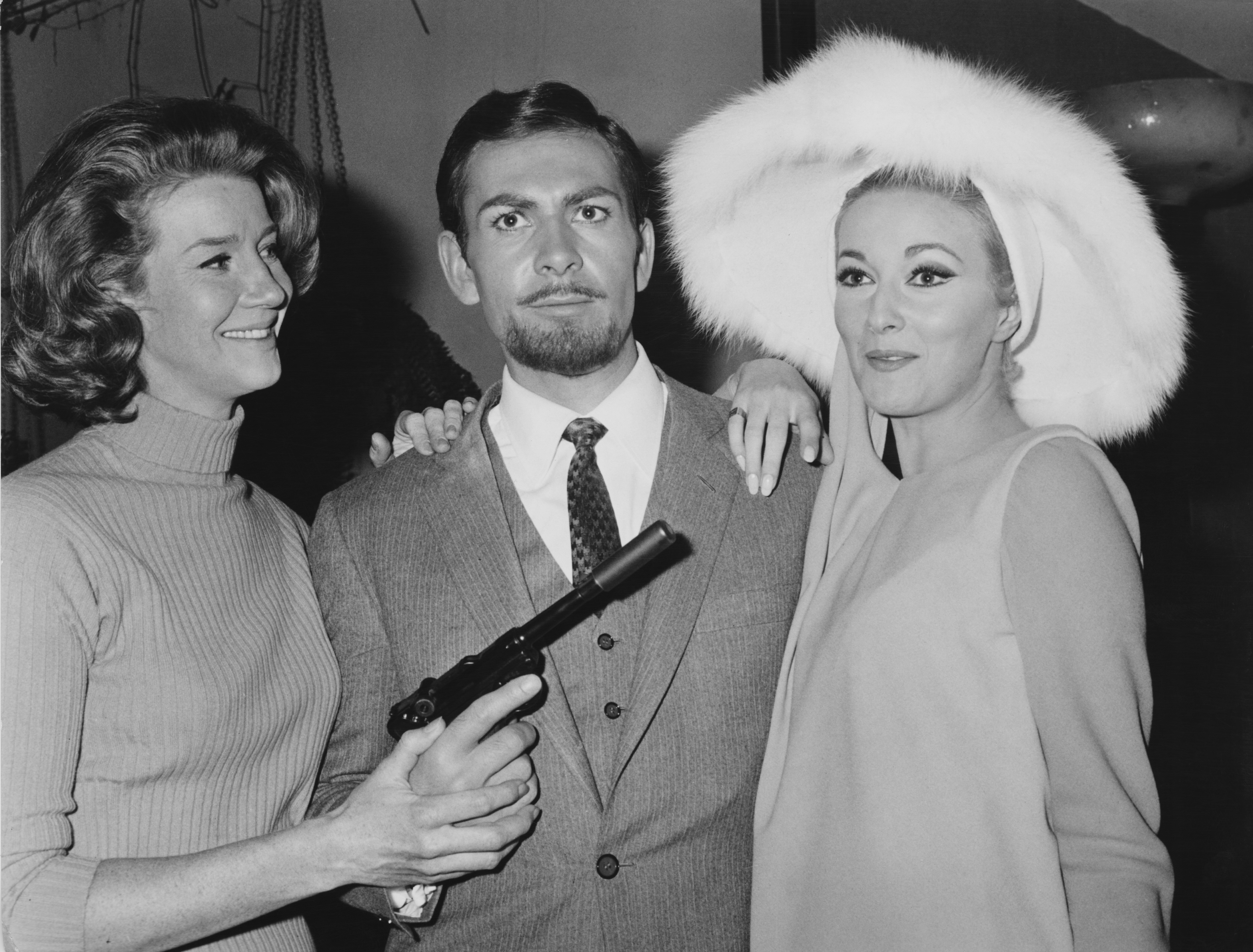 Actor Neil Connery, the brother of James Bond star Sean Connery, poses with actresses Lois Maxwell (left) and Daniela Bianchi (right), at a press conference for Bond spoof Operation Kid Brother in Italy on November 25, 1966 (Keystone/Hulton Archive/Getty Images)