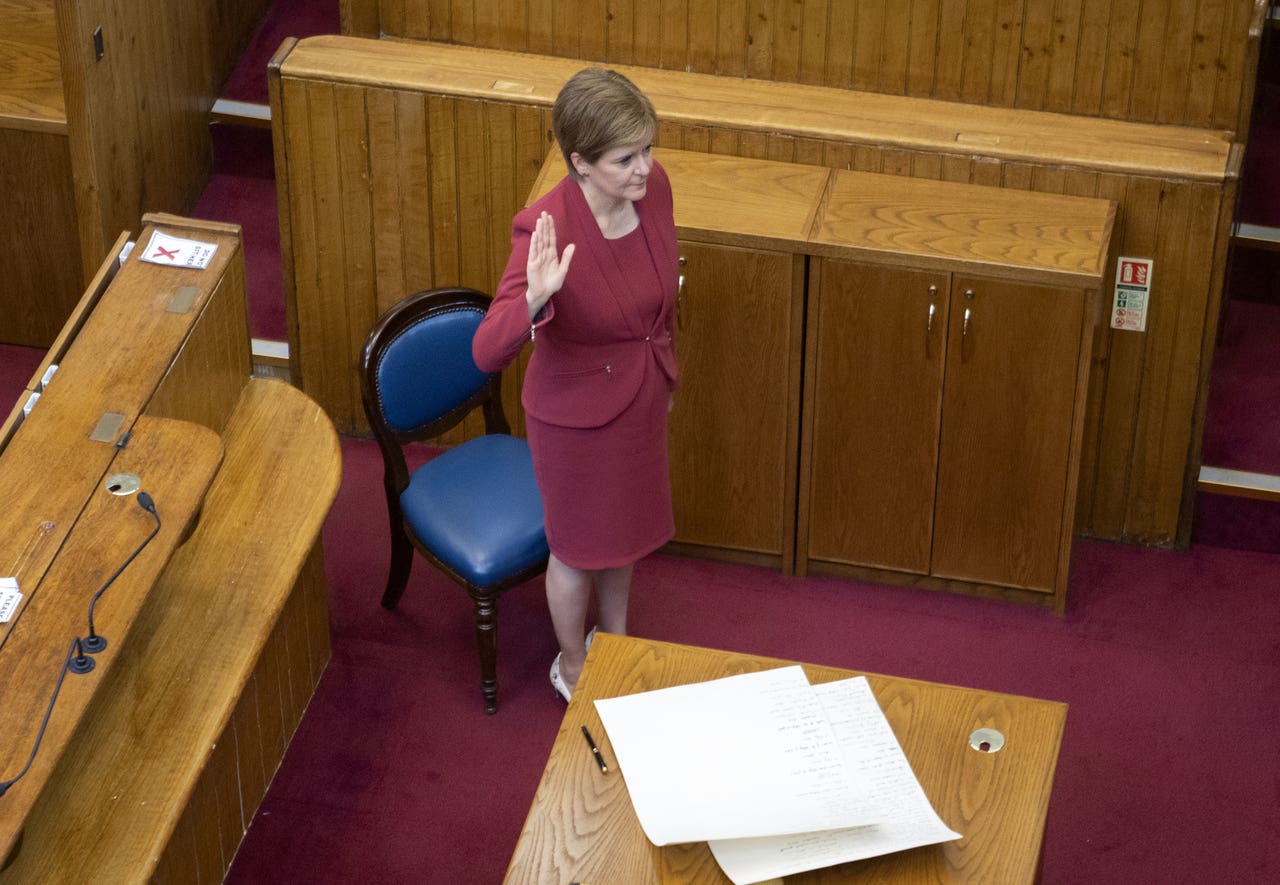 Nicola Sturgeon is sworn in as Scotland’s First Minister (Jane Barlow/PA)<br>” /><span class=
