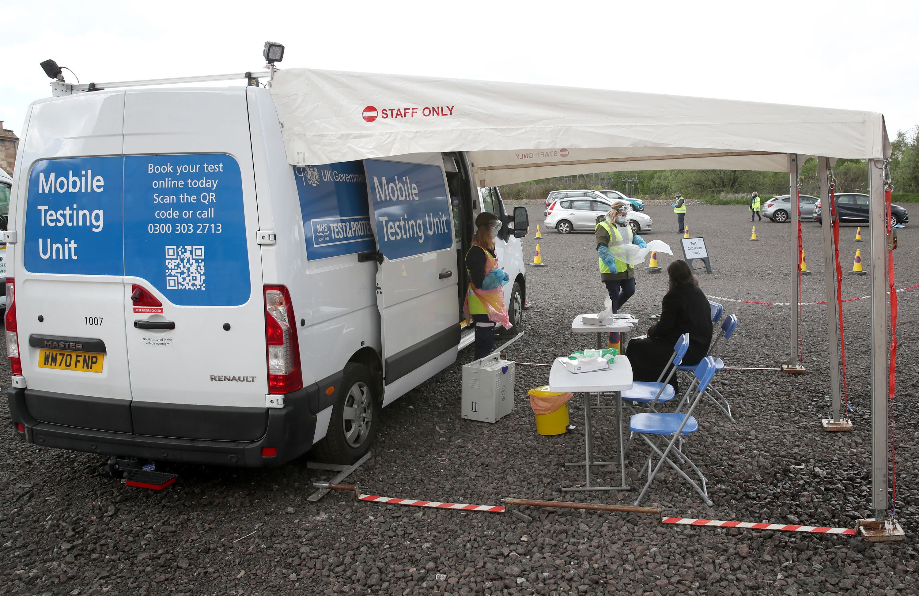 Staff from the Scottish Ambulance Service run a Covid Mobile Testing Unit from a car park in the Pollokshields area of Glasgow (Andrew Milligan/PA)