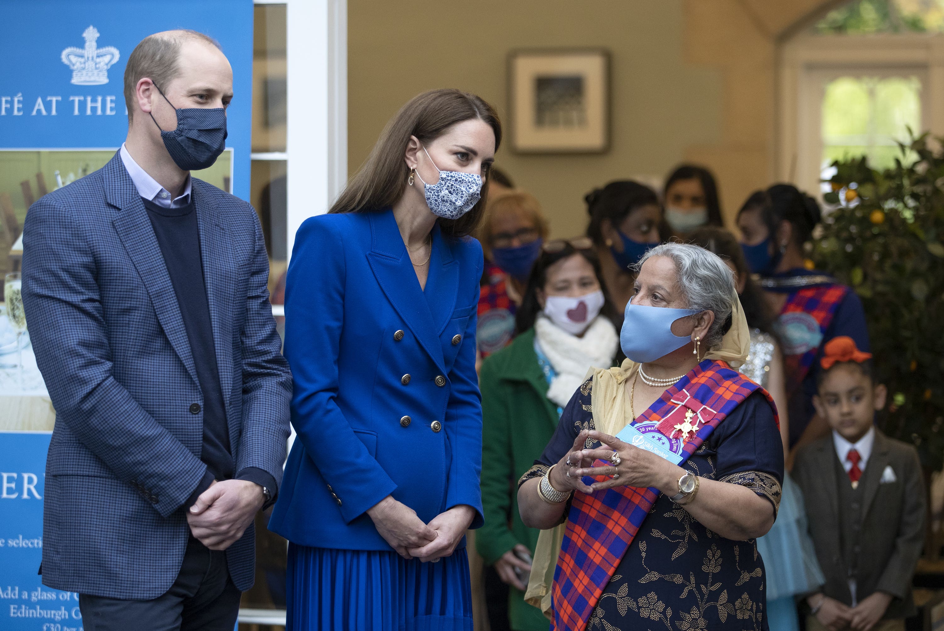 The couple helped prepare meals with representatives of Sikh Sanjog.