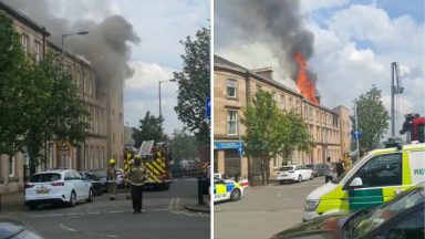 Top floor tenement flat engulfed in flames in Glasgow