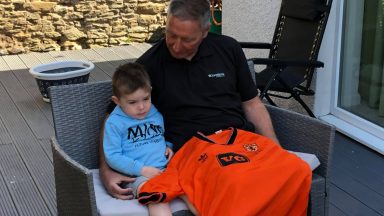 Football boss auctions rare jersey to help injured player