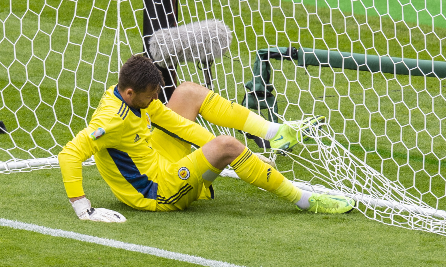 David Marshall untangles himself from the net after being lobbed from 50 yards.