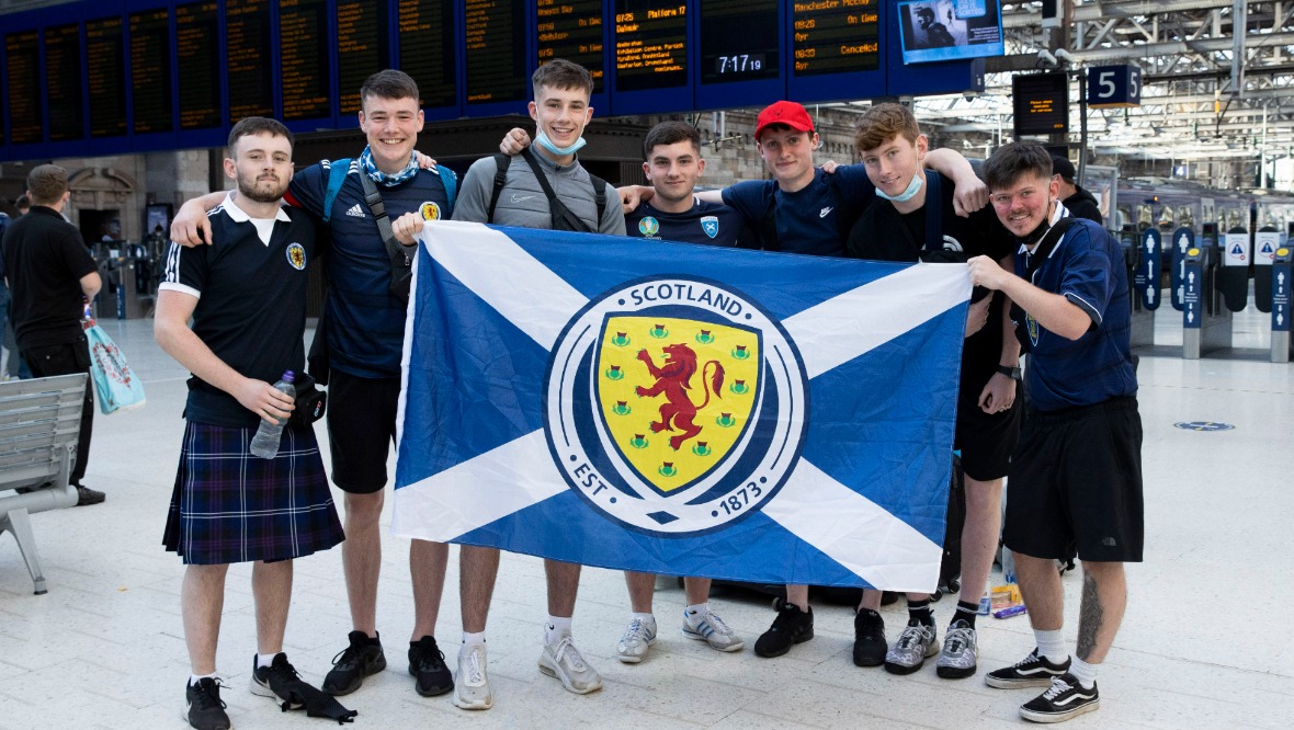 Glasgow Central: Scotland fans leaving for London.