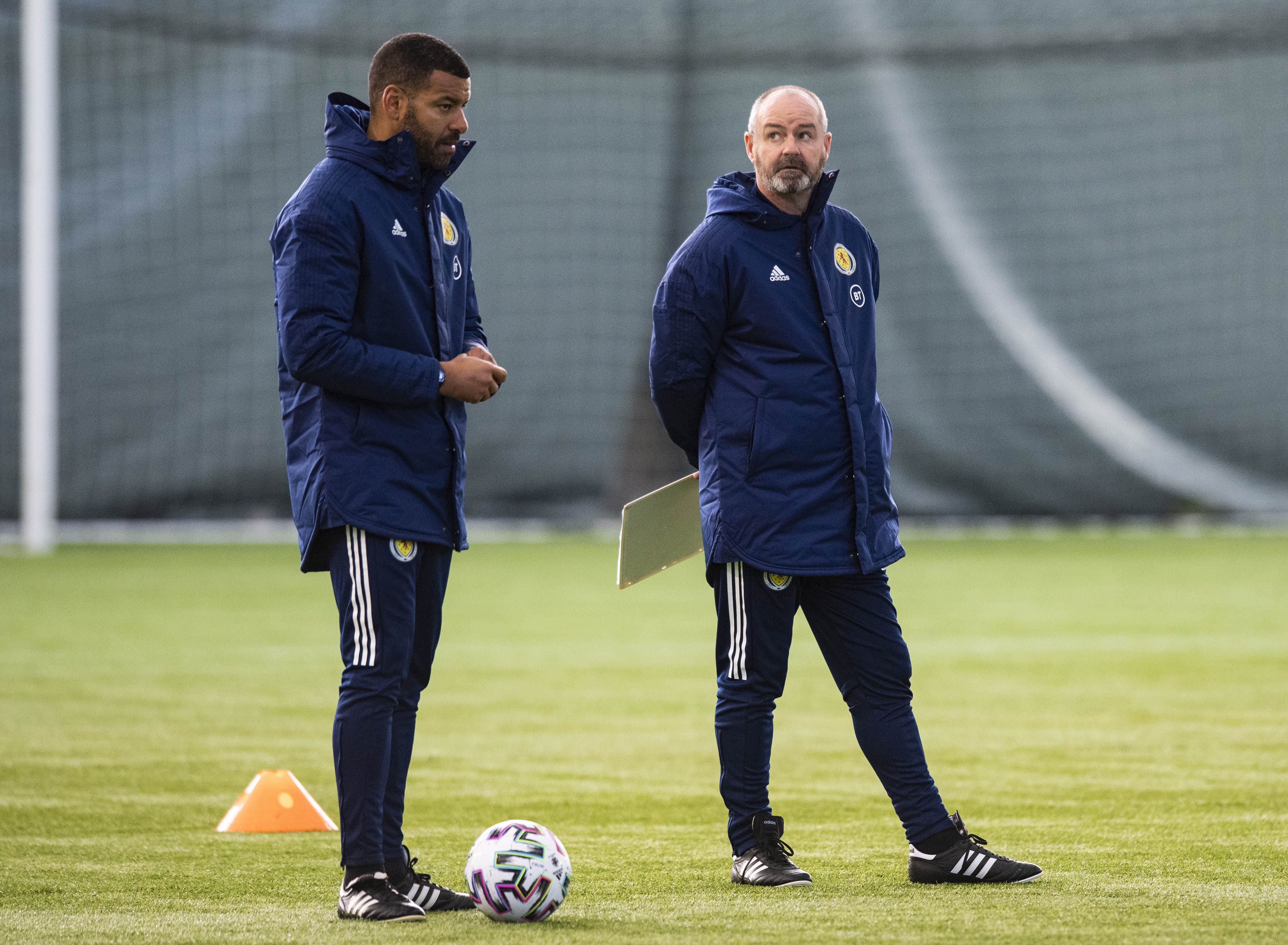 Clarke and Reid talk tactics during a Scotland training session.