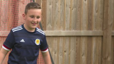 Young football fan hopes to be Scotland’s lucky charm