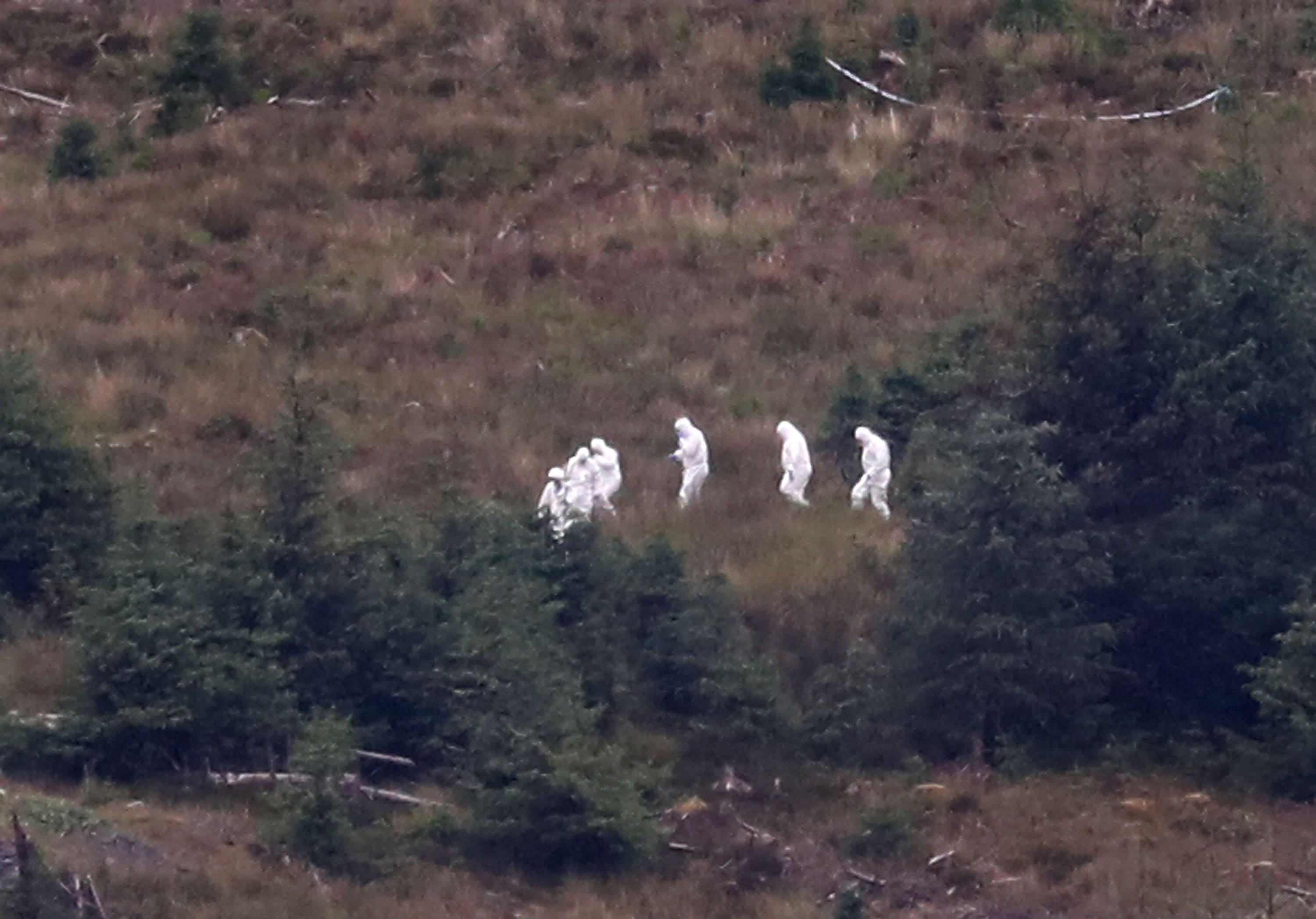 Police forensic officers carried out searches in the Galloway Forest (Andrew Milligan/PA