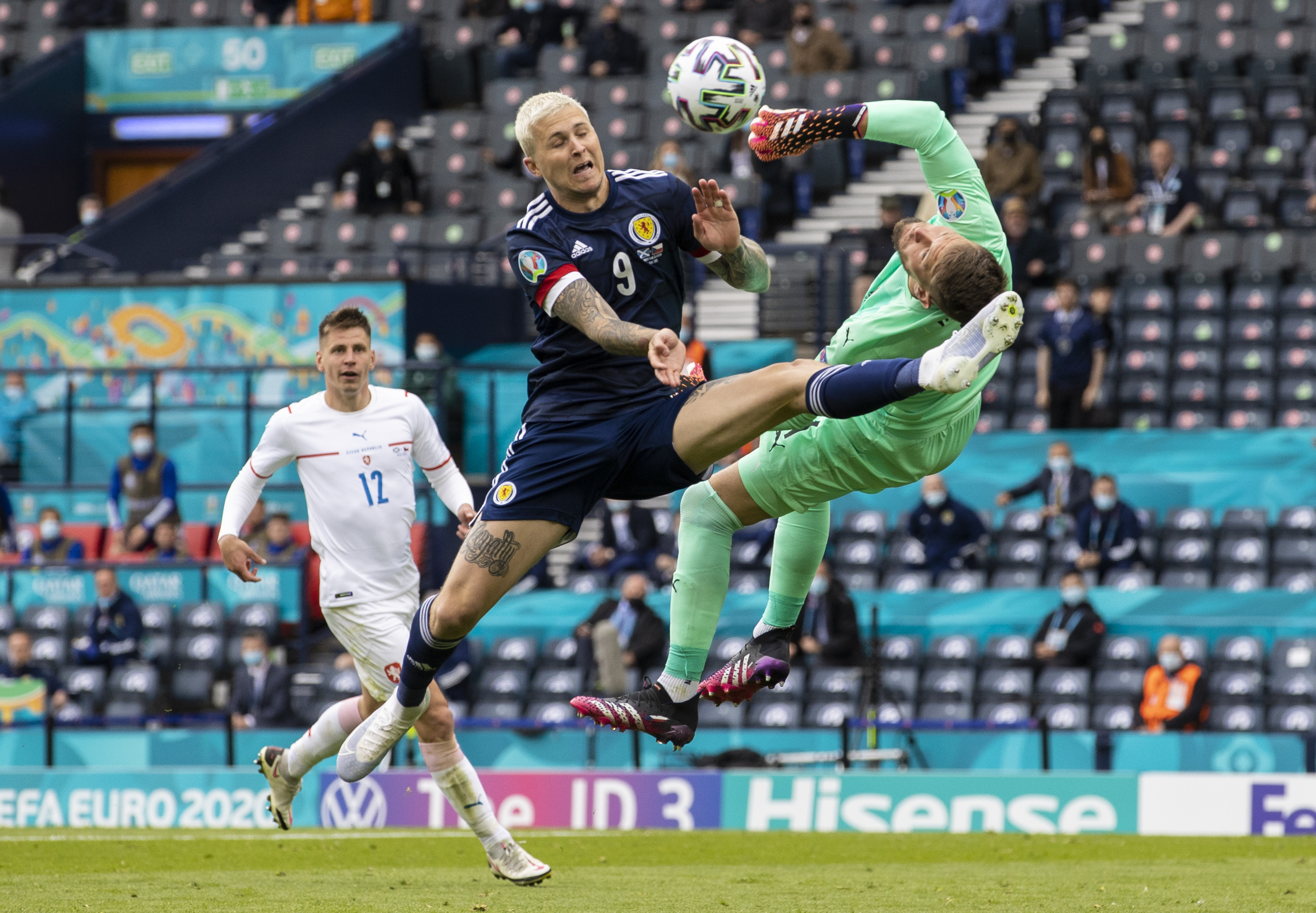 Lyndon Dykes battles with Tomáš Vaclík as the ball loops towards goal during the Euro 2020 match.